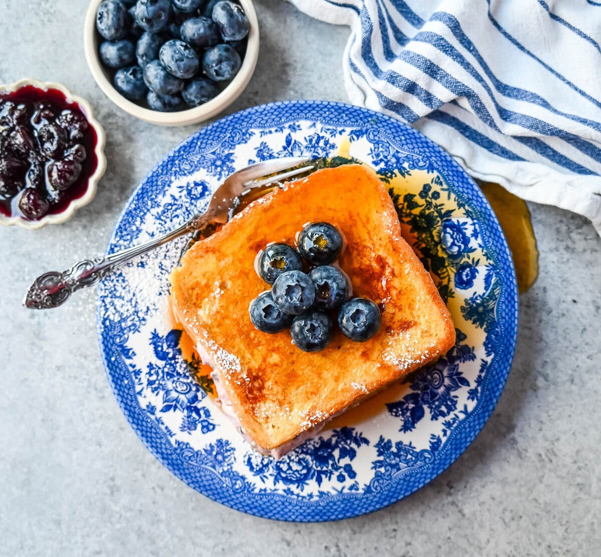 Blueberry Cheesecake Stuffed French Toast. This Blueberry Cream Cheese Stuffed French Toast Recipe is made with soft, thick bread stuffed with a homemade blueberry cream cheese and dipped in a vanilla custard batter and cooked until golden. 