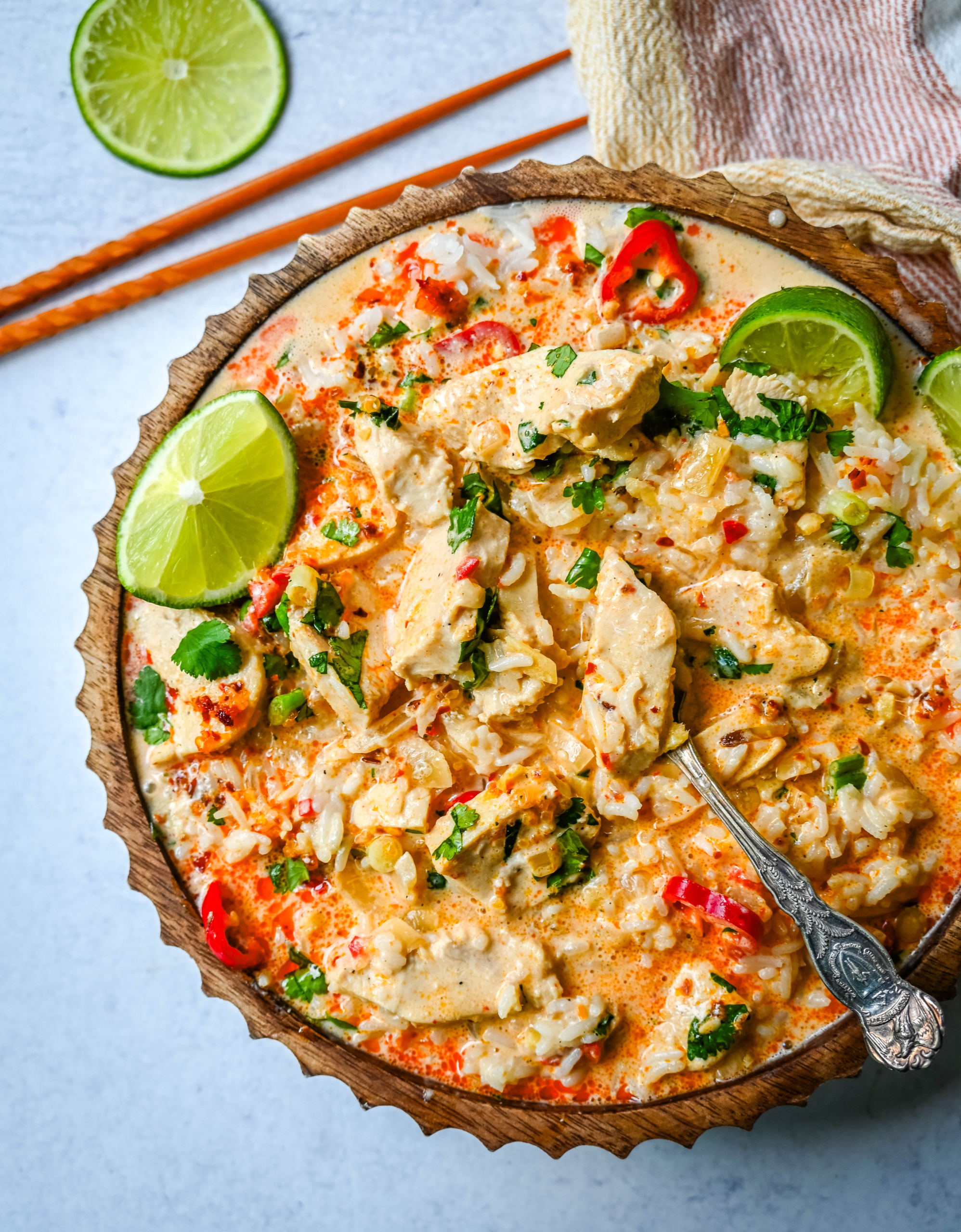 This tender Poached Coconut Milk Chicken with aromatics, creamy coconut milk, red Thai curry paste, and spices all atop rice is made in less than 30 minutes and is perfect for a weeknight dinner. 