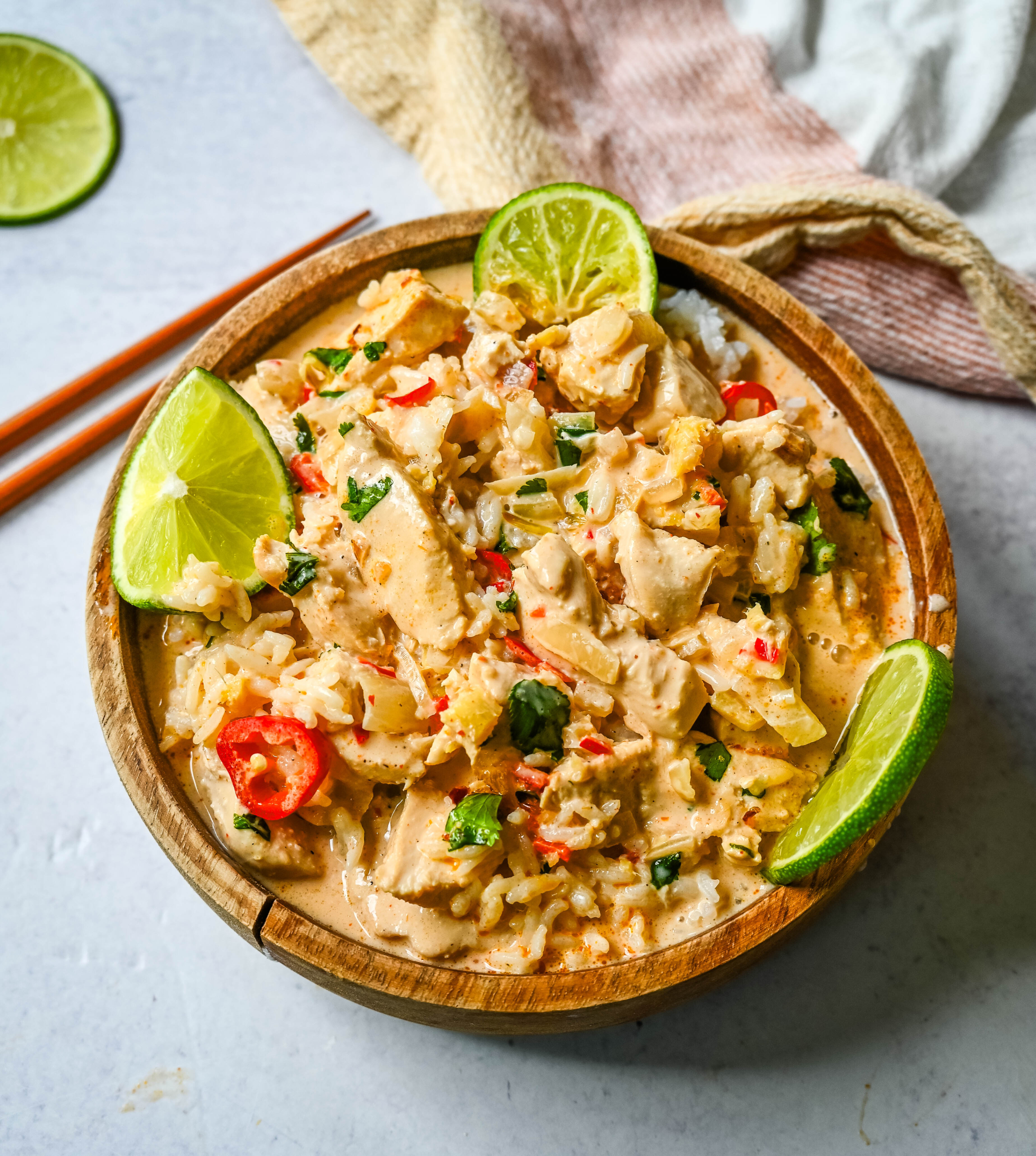 This tender Poached Coconut Milk Chicken with aromatics, creamy coconut milk, red Thai curry paste, and spices all atop rice is made in less than 30 minutes and is perfect for a weeknight dinner. 