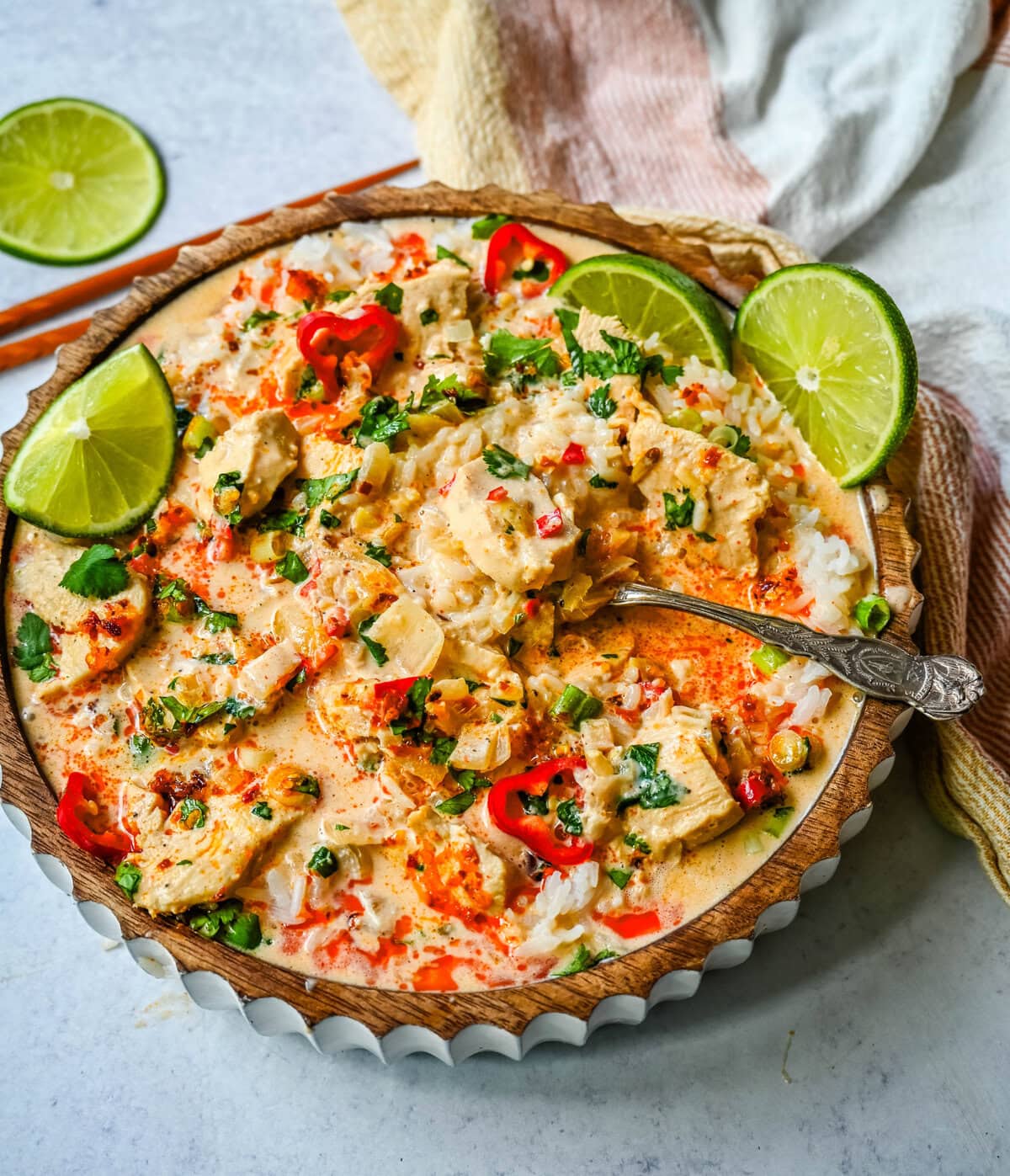 This tender Poached Coconut Milk Chicken with aromatics, creamy coconut milk, red Thai curry paste, and spices all atop rice is made in less than 30 minutes and is perfect for a weeknight dinner. 